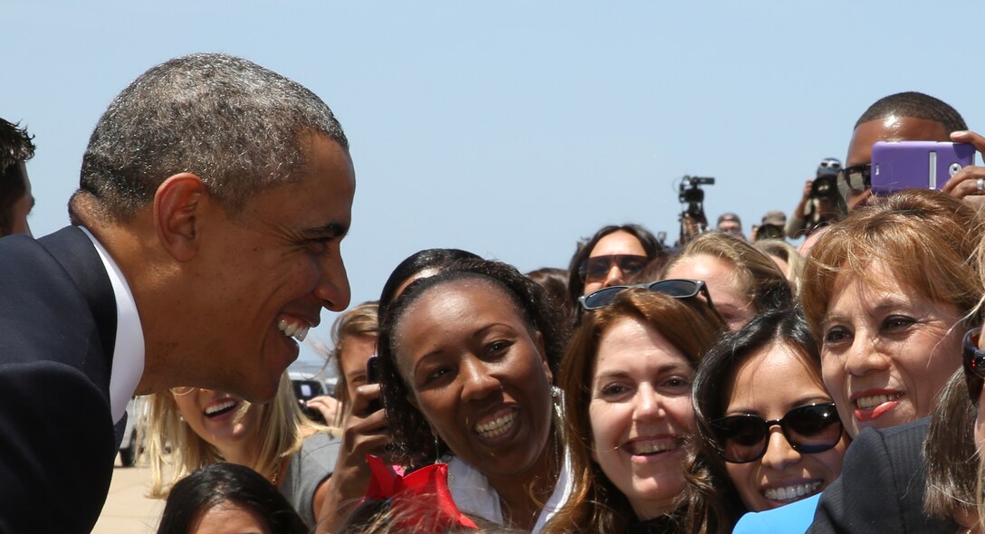 President Obama takes a moment to great the crowd at MCAS Miramar May 8, 2014. Obama came to San Diego for his fundraising event in La Jolla Calif. Obama arrived in Los Angeles May 7, as a part of  three-day trip to California to rais funds to help Democrats.