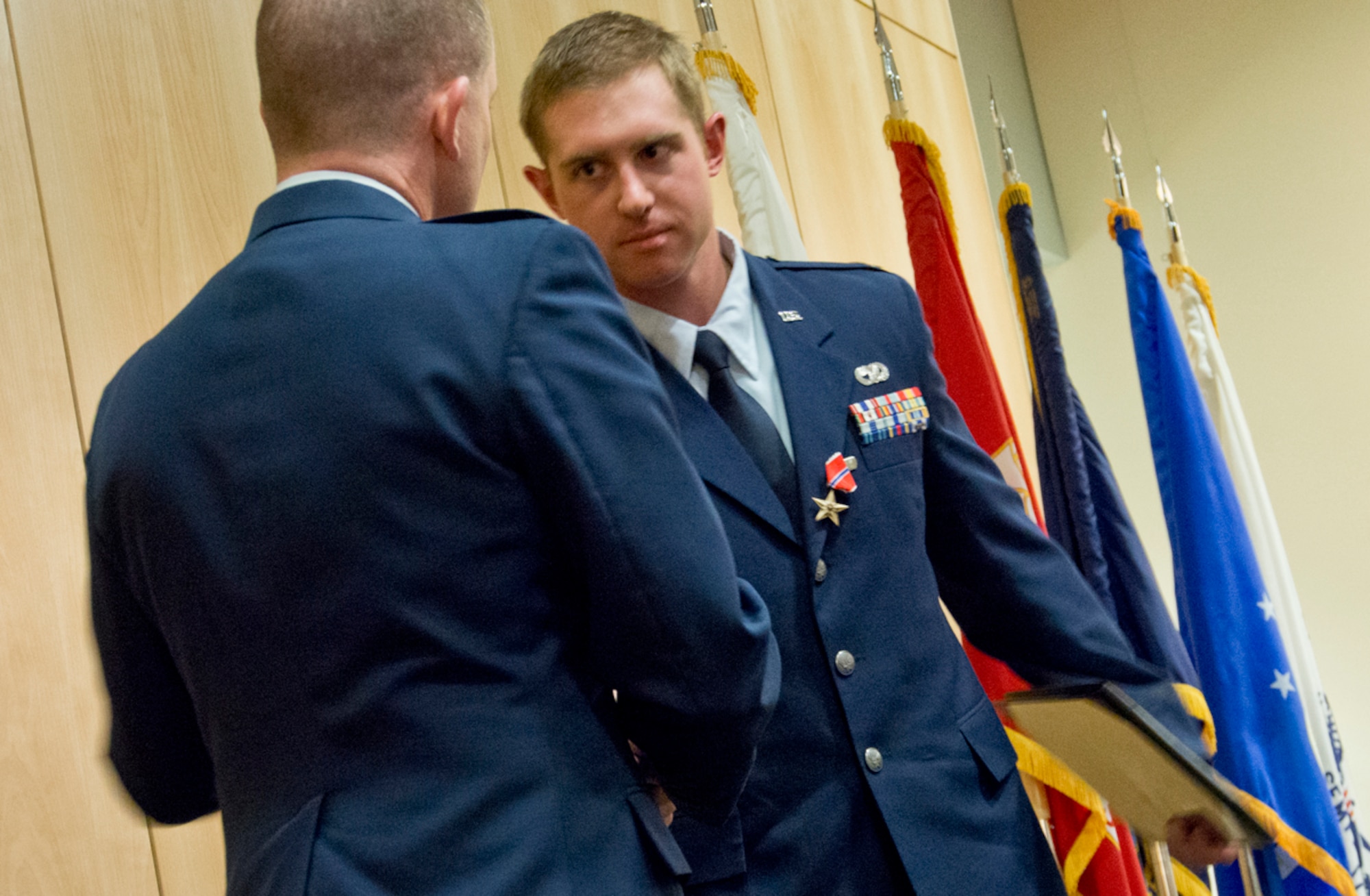 Photo from the Bronze Star Medal presentation by base commander Air Force Col. Brian Duffy on Joint Base Elmendorf-Richardson, Alaska, Tuesday, April 29, 2014, to Air Force Capt. Dayton Blume, a vehicle operations officer assigned to the 673d Logistics Readiness Squadron, who distinguished his self by exceptional meritorious service during a recent tour in support of Operation Enduring Freedom in Afghanistan.. (U.S. Air Force photo/Justin Connaher)