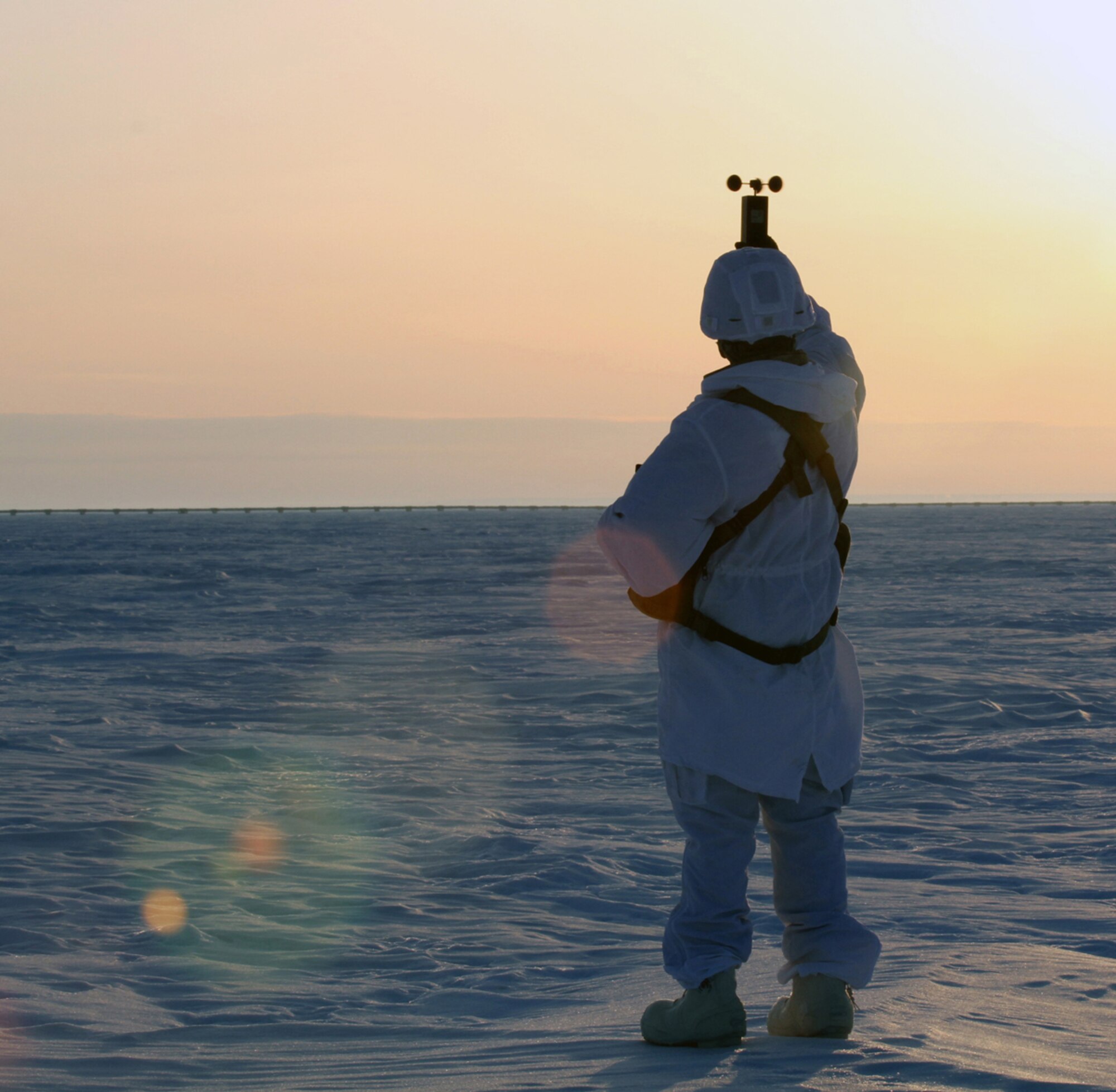 1st Sgt. William Jasper, first sergeant for Headquarters, Headquarters Company 6th Engineer Battalion (Airborne), 2nd Engineer Brigade, checks wind speed and direction in preparation for paratroopers to arrive during Arctic Pegasus May 1 near Deadhorse, Alaska. The goal of the Arctic mobility exercise is to enhance U.S. Army Alaska’s proficiency for conducting Arctic airborne operations, mobility and ground maneuvers in extreme cold-weather conditions. (Photo by Staff Sgt. Mylinda DuRousseau, 1/25 SBCT Public Affairs)