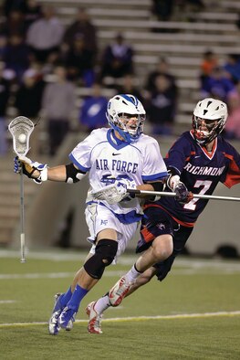 Air Force junior Nate Hruby looks to make a pass against Richmond at Falcon Field Wednesday. Air Force lacrosse beat Richmond 13 - 5, picking up their first-ever NCAA Tournament win. (U.S. Air Force Photo/Sarah Chambers)