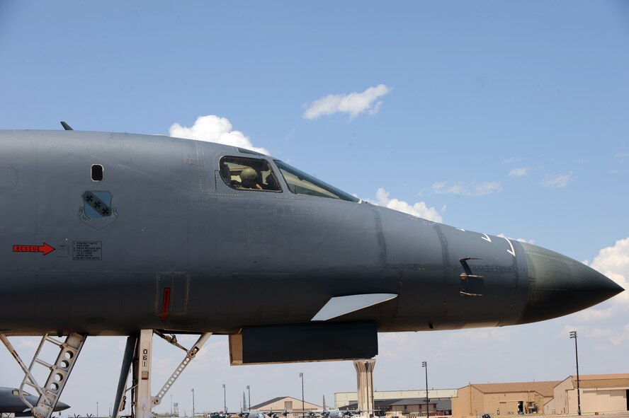 U.S. Air Force Maj. James Silva, 337th Test and Evaluation Squadron, goes over post-flight checklists on board a B-1B Lancer May 7, 2014, at Dyess Air Force Base, Texas. The aircraft is equipped with a modification that includes three different upgrades. One major upgrade incorporates a modern datalink communication network that allows real-time communication with other aircraft, ground stations, and allied forces. The data link also enhances crew awareness of the battle space, and allows for quicker targeting. (U.S. Air Force photo by Airman 1st Class Alexander Guerrero/Released)