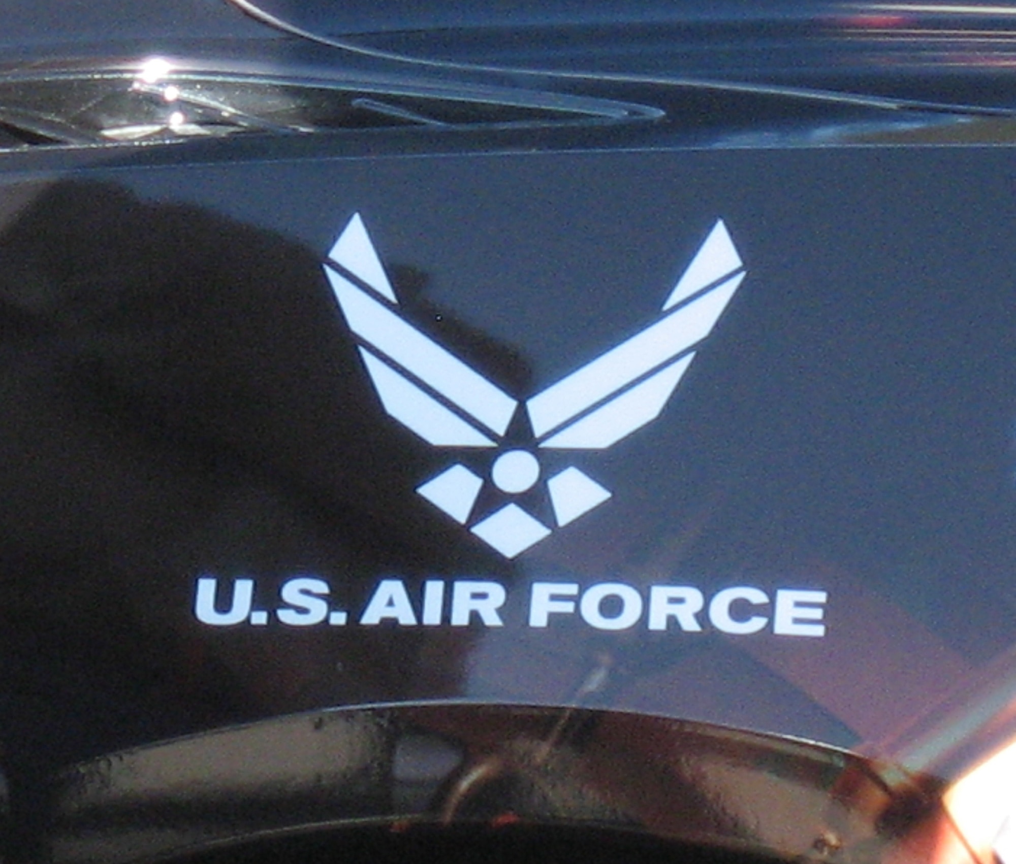 The U.S. Air Force logo is displayed on the back corner panel of the Semi-Autonomous Motorcar known as SAM.  The 711 Human Performance Wing was one of the organizations involved in the project. (USAF photo by Ted Theopolos)