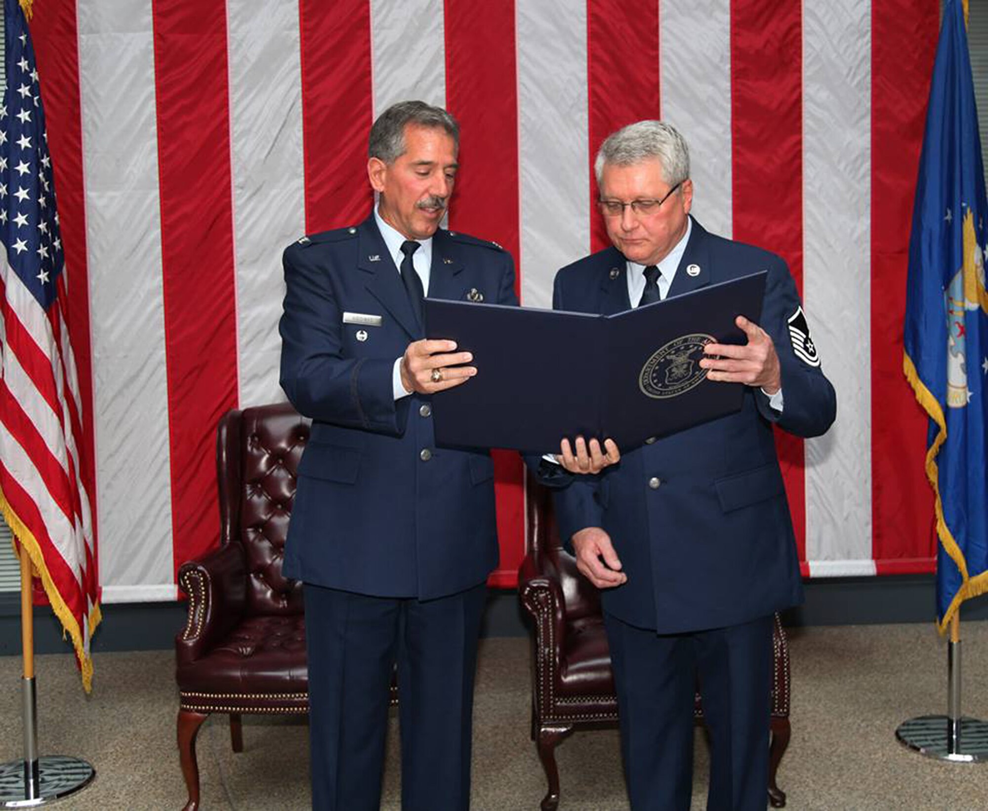TRAVIS AIR FORCE BASE, Calif. -- Friends and family celebrated the career of Master Sgt. Richard Ziesche, supervisor of safety, 349th Maintenance Group, during a retirement ceremony April 27, 2014 at Travis Air Force Base, Calif. Col. M. J. (Sonny) Giddings, Jr., 349th Air Mobility Wing, was the officiating officer and presented Ziesche with the Meritorious Service Medal. (U.S. Air Force photo/Lt. Col. Robert Couse-Baker)