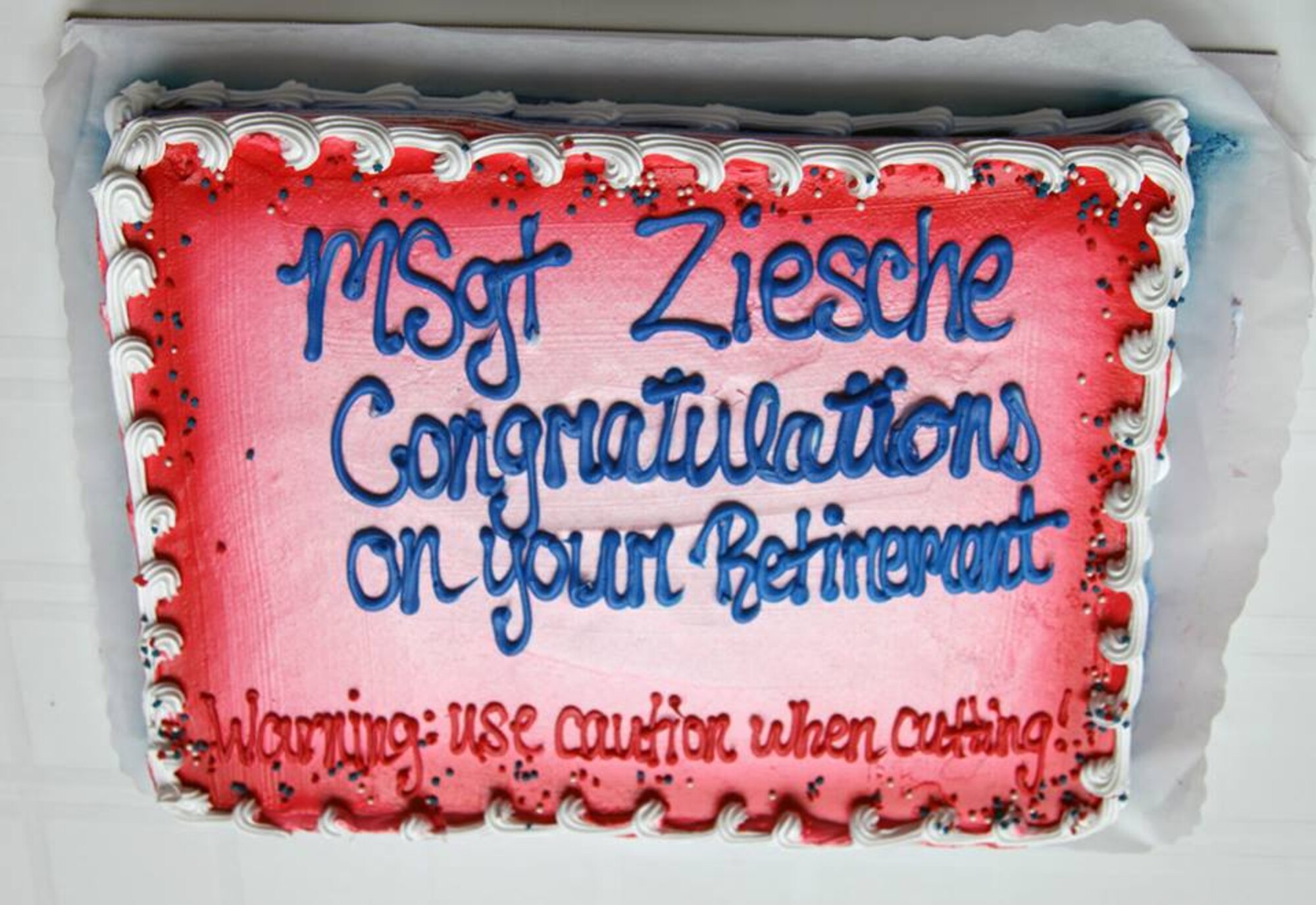 TRAVIS AIR FORCE BASE, Calif. -- Friends and family celebrated the career of Master Sgt. Richard Ziesche, supervisor of safety, 349th Maintenance Group, during a retirement ceremony April 27, 2014 at Travis Air Force Base, Calif. Col. M. J. (Sonny) Giddings, Jr., 349th Air Mobility Wing, was the officiating officer and presented Ziesche with the Meritorious Service Medal. (U.S. Air Force photo/Lt. Col. Robert Couse-Baker)