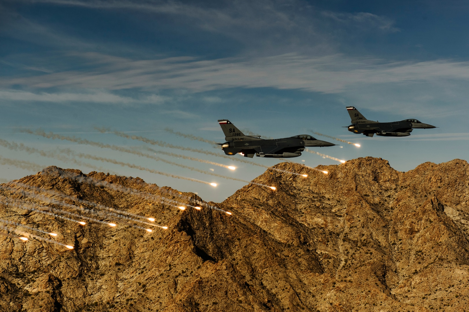 Two F-16C Fighting Falcon, 182nd Fighter Squadron, releases flares while conducting low-level combat training during Coronet Cactus exercise near Davis-Monthan Air Force Base, Ariz., April 10, 2014. This exercise provides realistic combat training for student fighter pilots from air-to-air combat to dropping inert and live ordnance. (U.S. Air Force photo/ Staff Sgt. Jonathan Snyder)
