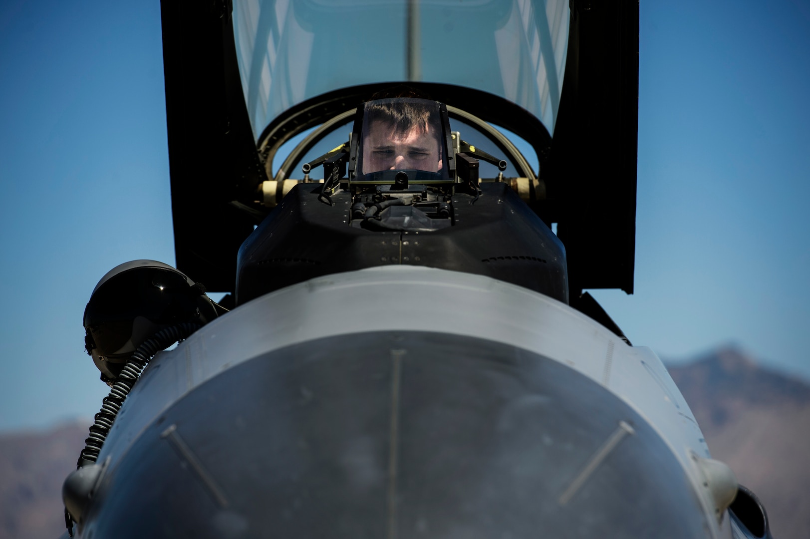 First Lt. Jayme Liggett, 182nd Fighter Squadron, conducts a pre-flight check in an F-16C Fighting Falcon prior to a combat training sortie at Davis-Monthan Air Force Base, Ariz., April 8, 2014. Coronet Cactus exercise provides realistic deployment experience for F-16 student pilots. (U.S. Air Force photo/ Staff Sgt. Jonathan Snyder)