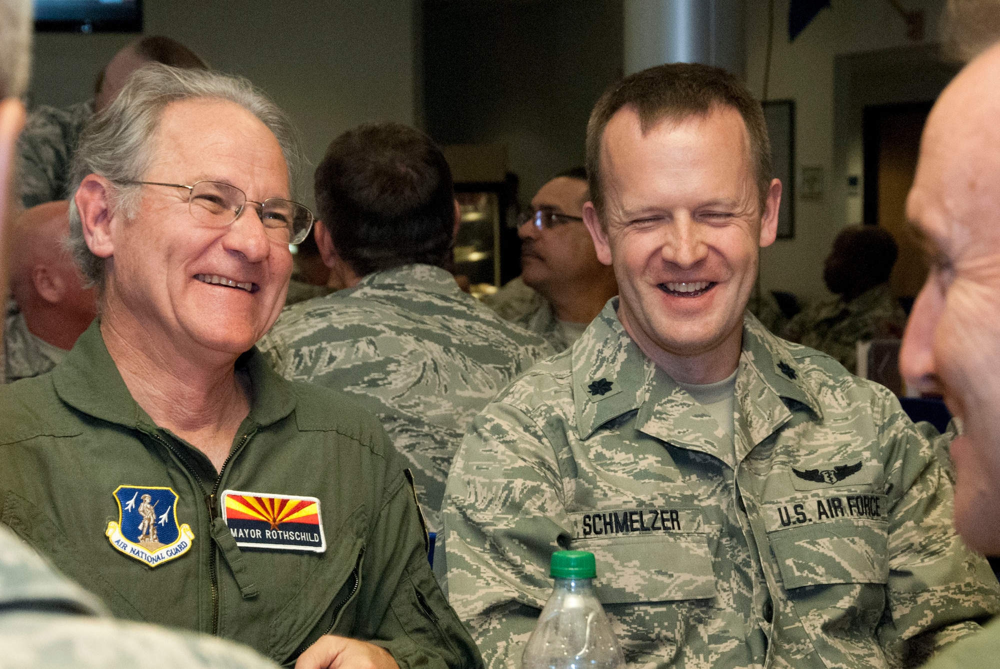 Jonathan Rothschild, Mayor of Tucson, shares a laugh with Lt Col Christopher Schmelzer and Col. Howard "Phil" Purcell, commander of the 162nd Wing , while having lunch at the dining facility at the 162nd Wing May 3.  Rothschild was invited to the 162nd Wing to participate in an orientation flight, which raises awareness and understanding about the wing’s mission.  (U.S. Air National Guard photo by Tech. Sgt. Hollie Hansen/Released)