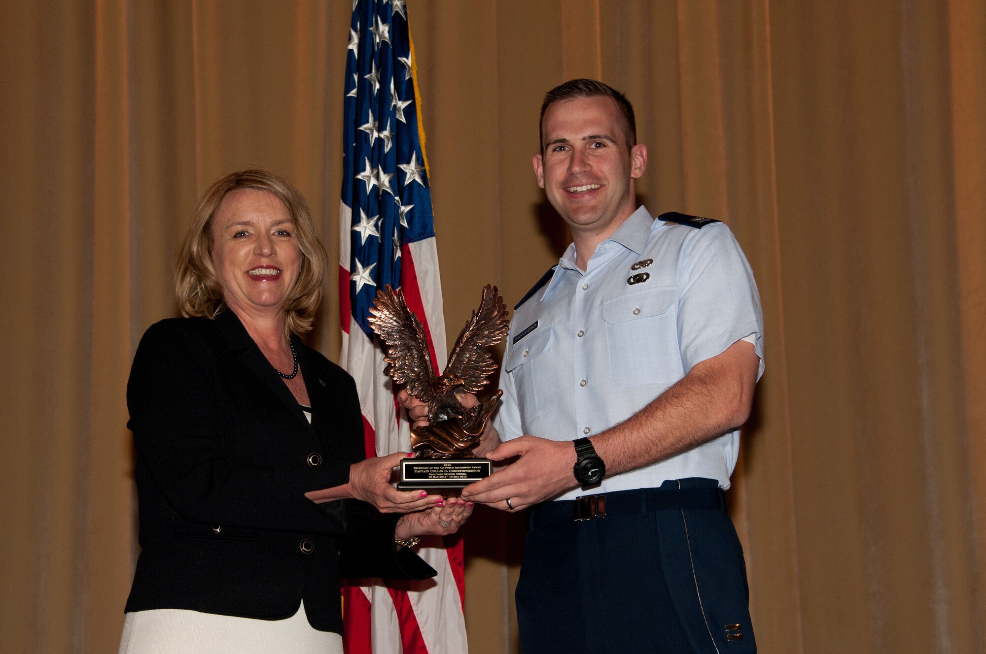 Secretary of the Air Force Deborah Lee James presents the Secretary of the Air Force Leadership Award to Squadron Officer School student Capt. Collin Christopherson, May 5, at Maxwell. (Photo by Bud Hancock) 