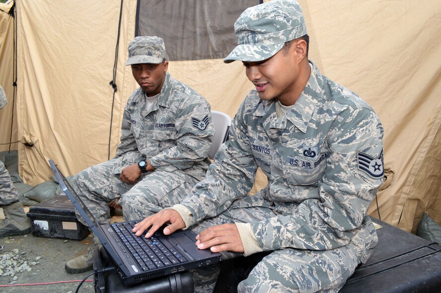 Air Force Staff Sgt. Alvin Delos Santos, a command and control battle management operations specialist, right, and Staff Sgt. Darius Harper, both from the 682nd Air Support Operations Squadron, test the Air Support Operations Center Gateway communication systems during Warfighter 14-04 exercise, April 9, Fort Bragg, N.C. The Warfighter is a command post training exercise, designed and led by the Mission Command Training Program at Fort Leavenworth, Kansas, which simulates scenarios units might encounter in war. The exercises are designed to challenge commanders and their staffs to be both tactical and academic in their approach to wartime decision making. The state-of-the-art ASOC Gateway shortens the kill chain, reduces humanistic error and improves situational awareness for pilots, aircrew and joint terminal attack controllers. The ASOC is the primary command and control agency for integrating joint air power with Army operations. Fighter duty technicians coordinate air support for the JTACs and provide airspace de-confliction for tasked aircraft. Once JTACs receive a handoff of aircraft from the ASOC, it's their job to direct the fighters to the correct targets within close proximity to ground forces using radios and communications equipment. (U.S. Air Force photo/Marvin Krause)

