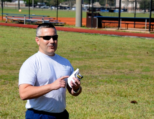 Chief Master Sgt. Tony Rodriguez, air transportation superintendent of the 70th Aerial Port Squadron, explains the significance of the 5K to participants on the track behind the Sam Johnson Fitness Center at Homestead Air Reserve Base, Fla., May 4. The 70th APS held a Port Dawg 5K as an inaugural memorial to honor fallen members of Aerial Port Squadrons around the world. (U.S. Air Force photo/Senior Airman Nicholas Caceres)