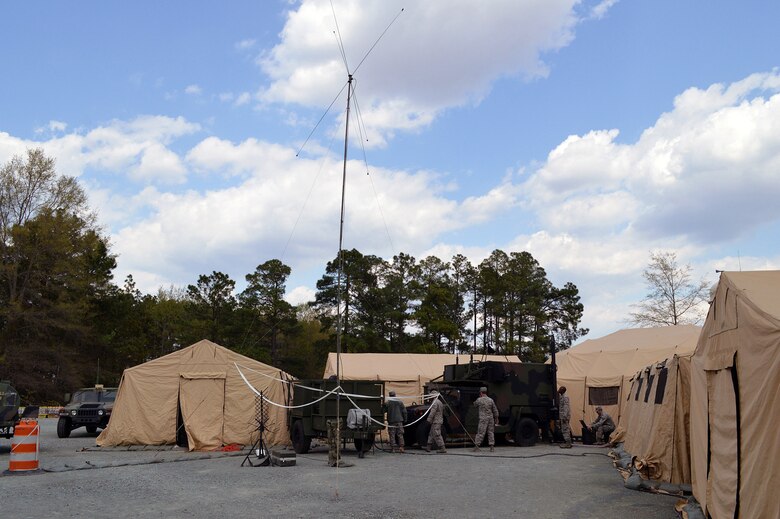 Airmen from the 682nd Air Support Operations Squadron maintain and operate the mobile Air Support Operations Center Gateway vehicle during Warfighter 14-04 exercise, April 9, Fort Bragg, N.C. The Warfighter is a command post training exercise, designed and led by the Mission Command Training Program at Fort Leavenworth, Kansas, which simulates scenarios units might encounter in war. The exercises are designed to challenge commanders and their staffs to be both tactical and academic in their approach to wartime decision making.
The state-of-the-art ASOC Gateway shortens the kill chain, reduces humanistic error and improves situational awareness for pilots, aircrew and joint terminal attack controllers. The ASOC is the primary command and control agency for integrating joint air power with Army operations. Fighter duty technicians coordinate air support for the JTACs and provide airspace de-confliction for tasked aircraft. Once JTACs receive a handoff of aircraft from the ASOC, it's their job to direct the fighters to the correct targets within close proximity to ground forces using radios and communications equipment. (U.S. Air Force photo/Marvin Krause)
