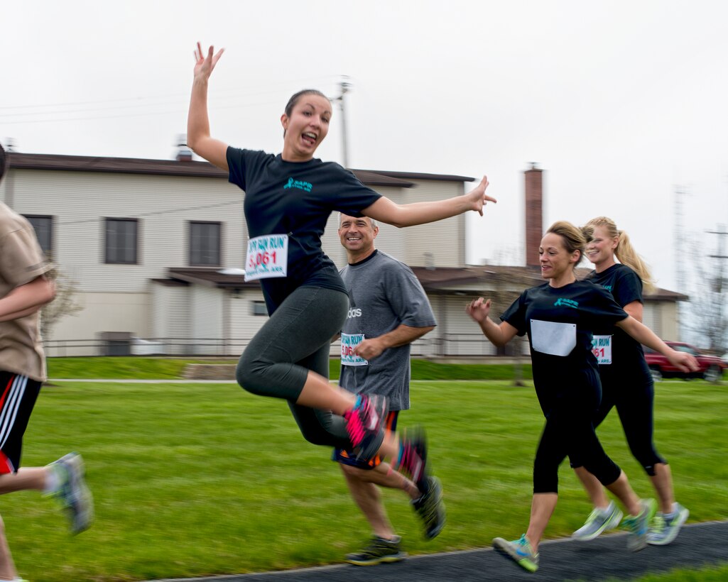 Officially April is Sexual Assault Awareness Month (SAAM), but members of the Niagara Falls Air Reserve Station continued their focus on SAPR participating in a 2 mile Fun Run/Walk, May 7, 2014, Niagara Falls, N.Y. Runners were tasked along the route with various scenarios to symbolize that although sexual assault victims may have obstacles along the way they can make it to the finish and get their lives back with support from their leadership and wingmen. (U.S. Air Force photo by Tech. Sgt. Joseph McKee)