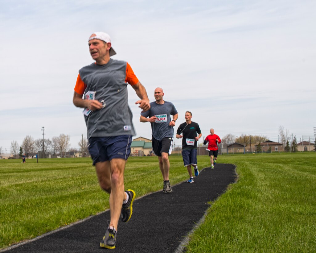 Officially April is Sexual Assault Awareness Month (SAAM), but members of the Niagara Falls Air Reserve Station continued their focus on SAPR participating in a 2 mile Fun Run/Walk, May 7, 2014, Niagara Falls, N.Y. Runners were tasked along the route with various scenarios to symbolize that although sexual assault victims may have obstacles along the way they can make it to the finish and get their lives back with support from their leadership and wingmen. (U.S. Air Force photo by Tech. Sgt. Joseph McKee)