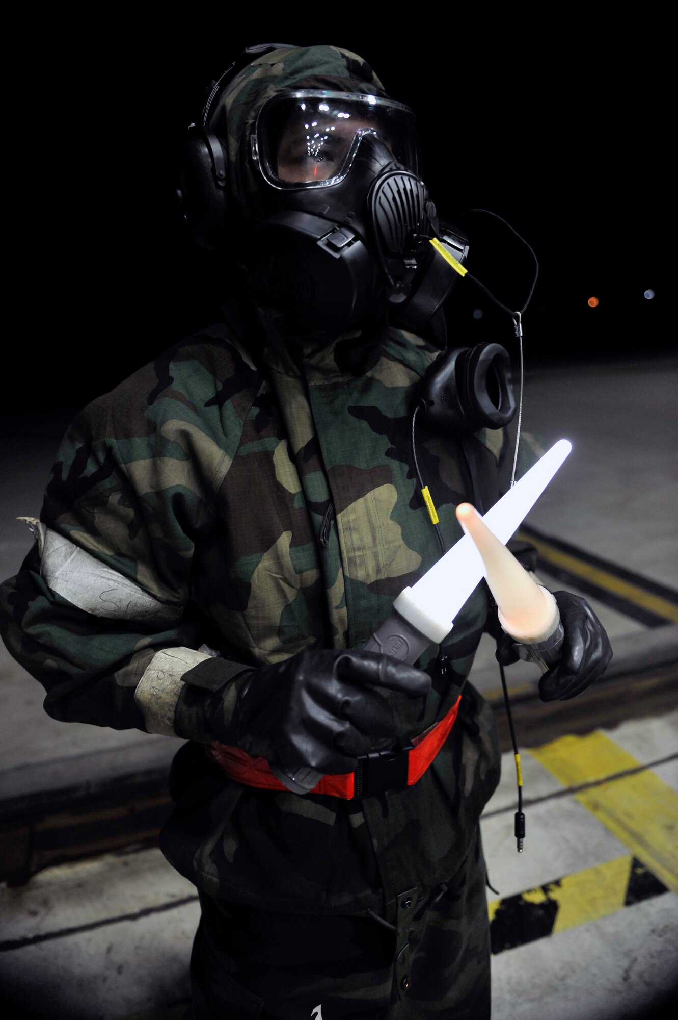 Senior Airman Mario Quintana, 36th Aircraft Maintenance Unit crew chief, holds an F-16 pilot prior to take off after Airmen were released to continue their mission during a theater ballistic missile attack scenario May 8 on Osan Air Base, Republic of Korea. Operational Readiness Exercises give aircrews and pilots from both of Osan’s fighter squadron’s critical time to practice performing at the optimum level needed to succeed during real-world contingency operations. (U.S. Air Force photo by Senior Airman David Owsianka)