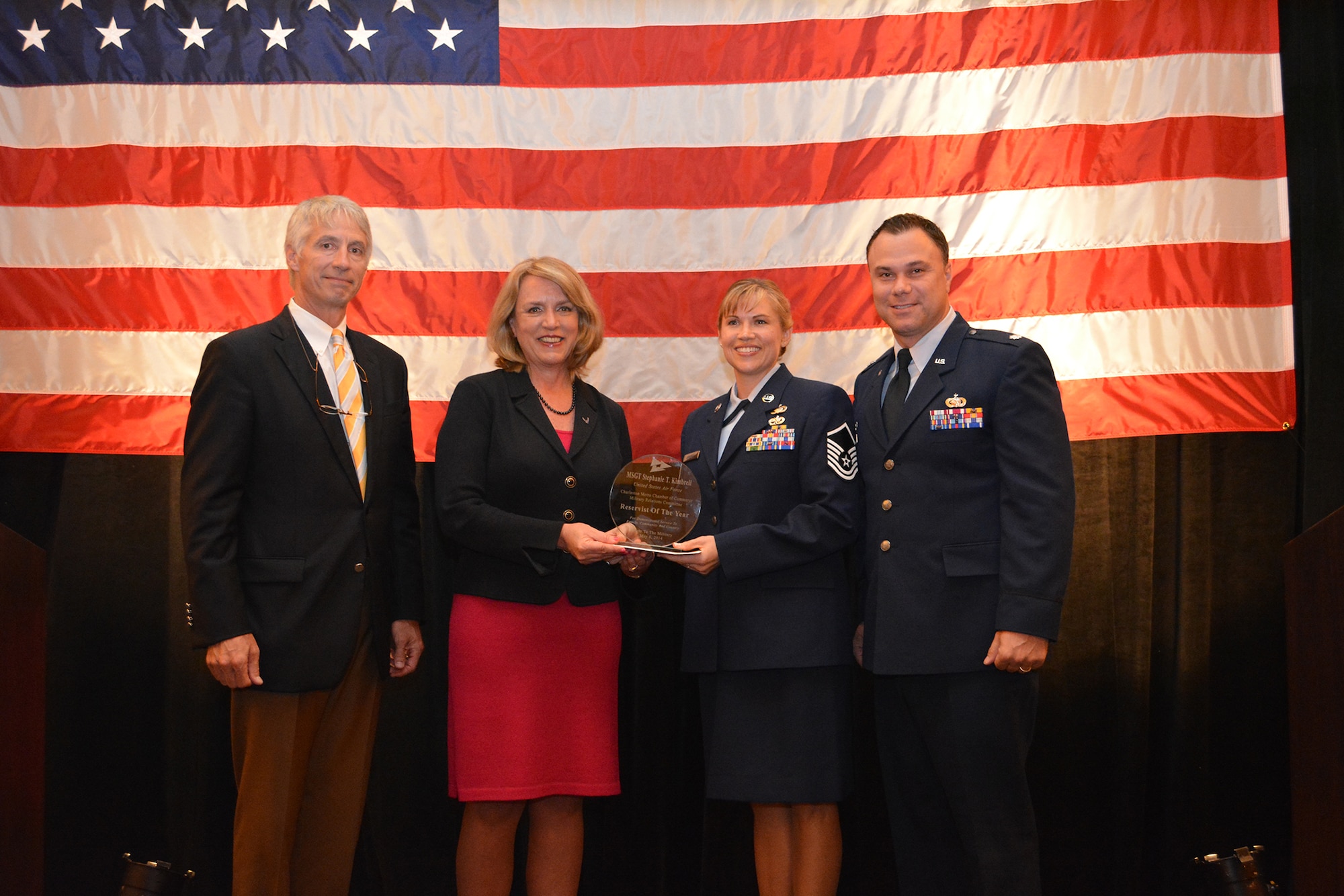 (from left) Chris Fraser, Charleston Metro Chamber of Commerce 2014 chairman of the board, Air Force Secretary Deborah Lee James, Master Sgt. Stephanie Kimbrell, 315th Logistics Readiness Squadron, and Lt. Col. Bobby Degregorio, 315th LRS commander, pose for a photo after Kimbrell was selected Reservist of the Year by the Chamber May 6 at the Charleston Marriott. (Photo courtesy the Charleston Metro Chamber of Commerce)