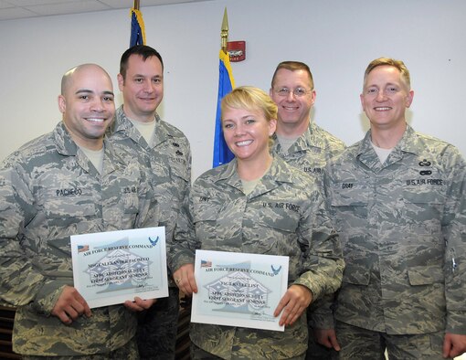(Front) Master Sgt. Alexander Pacheco and Tech. Sgt. Kalee Lint receive their Air Force Reserve Command Additional Duty First Sergeant Seminar certificates April 11, 2014 at the Niagara Falls Air Reserve Station, N.Y.  Also pictured are (back l to r) Chief Master Sgt. Clinton Ronan, 914th Airlift Wing Command Chief, Chief Master Sgt. Steven Larwood, 910th Airlift Wing Command Chief, and Senior Master Sgt. Jeff Gray, 914th Maintenance Squadron First Sergeant.  (U.S. Air Force photo by Peter Borys)