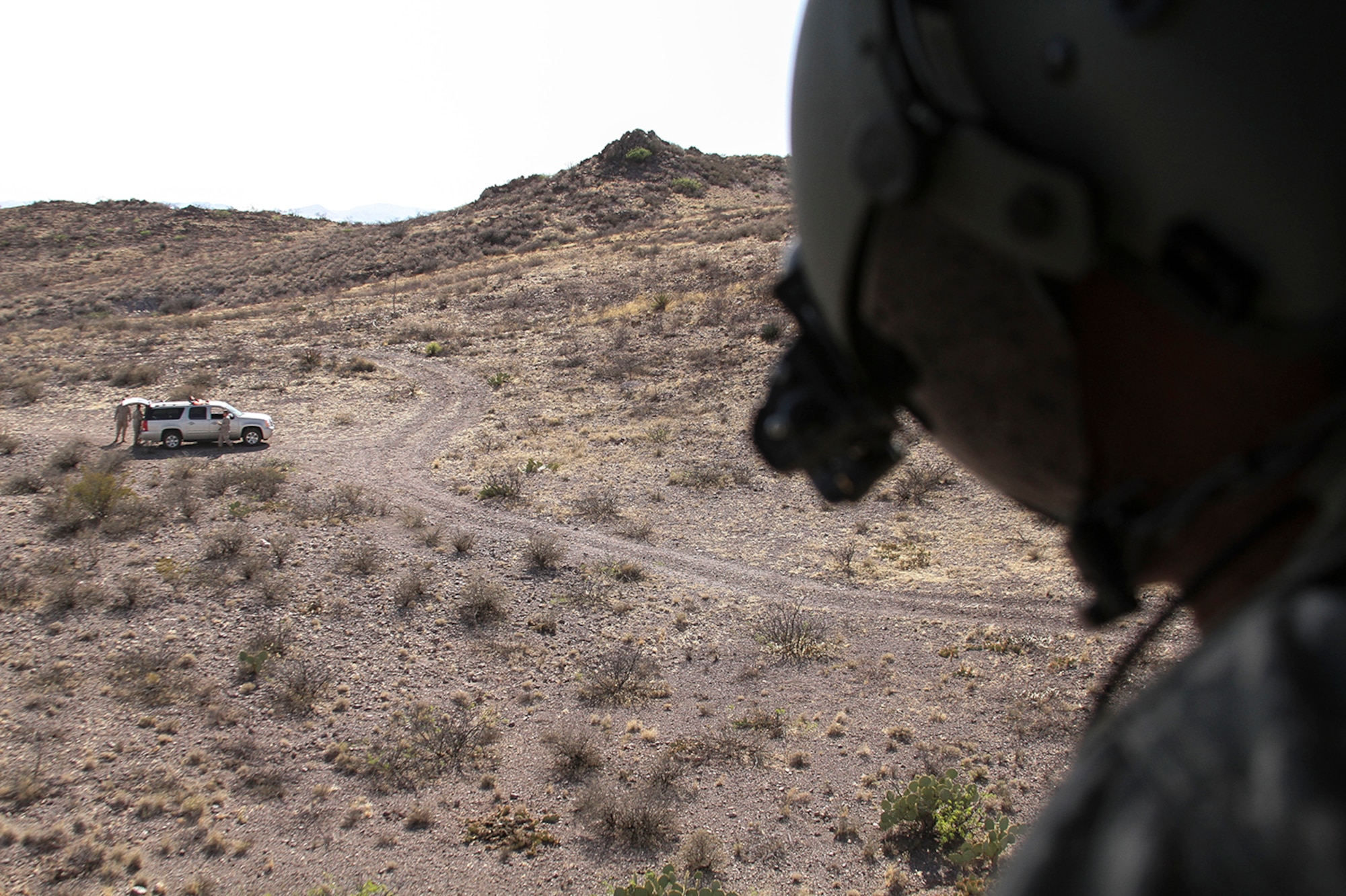 Spc. T.J. Hayer, a medical technician assigned to the 7th Battalion, 158th Aviation Regiment of the Army National Guard, prepares to receive more simulated casualties from a ground unit during a simulated casualty evacuation scenario as part of Exercise ANGEL THUNDER at Davis-Monthan AFB, Ariz., May 7, 2014.  ANGEL THUNDER is a multilateral annual exercise that to supports DoD’s training requirements for Personnel Recovery responsibilities through high–fidelity exercises.  Exercise ANGEL THUNDER focuses on scenarios that rescue forces are likely to face in current and future contingencies—increasing their combat readiness across a range of military options. (U.S. Air Force photo by Tech. Sgt. Heather R. Redman/Released)