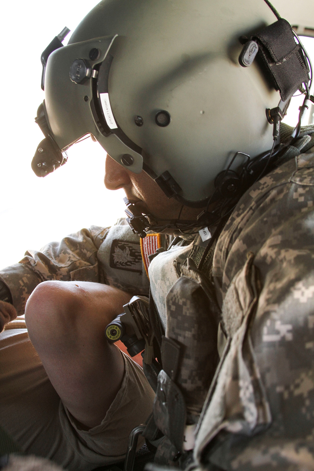 Spc. T.J. Hayer, a medical technician assigned to the 7th Battalion, 158th Aviation of the Army National Guard, straps Sgt. Ryan Swain onto a liter during a simulated casualty evacuation scenario as part of Exercise ANGEL THUNDER at Davis-Monthan AFB, Ariz., May 7, 2014.  ANGEL THUNDER is a multilateral annual exercise that to supports DoD’s training requirements for Personnel Recovery responsibilities through high–fidelity exercises.  Exercise ANGEL THUNDER focuses on scenarios that rescue forces are likely to face in current and future contingencies—increasing their combat readiness across a range of military options. (U.S. Air Force photo by Tech. Sgt. Heather R. Redman/Released)