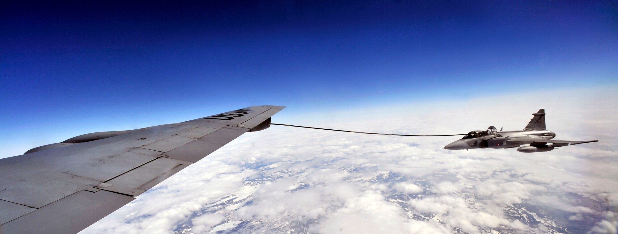 A Swedish air force JAS-39 Gripen takes on fuel from a 100th Air Refueling Wing KC-135 Stratotanker during routine training over Sweden May 7, 2014. Sweden, Norway and Finland train frequently with the U.S. Air Force to maintain proficiency in air refueling missions.  The 100th ARW provides refueling for aircraft throughout Europe, Africa and Southwest Asia. (U.S. Air Force photo by Senior Airman Christine Griffiths/Released)