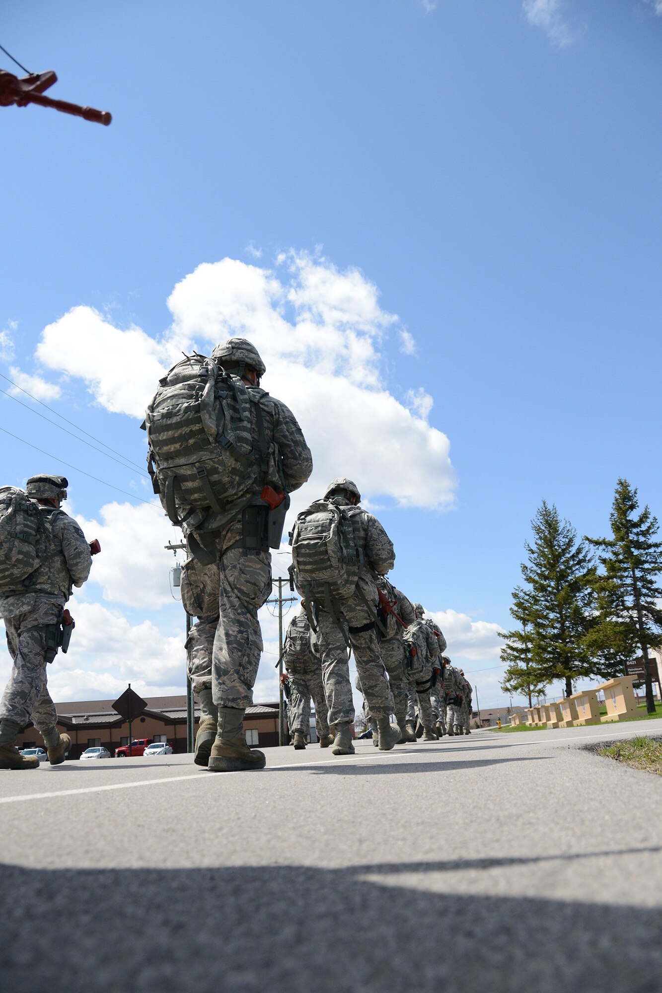 Airmen of the 914th Airlift Wing's Security Forces Squadron participate in a three-mile ruck march during the May Unit Training Assembly, May 3, 2014 at the Niagara Falls Air Reserve Station, N.Y.  The Airmen, each carrying more than 50 pounds of gear, complete morale marches like this quarterly.  (U.S. Air Force photo by Tech. Sgt. Andrew Caya)