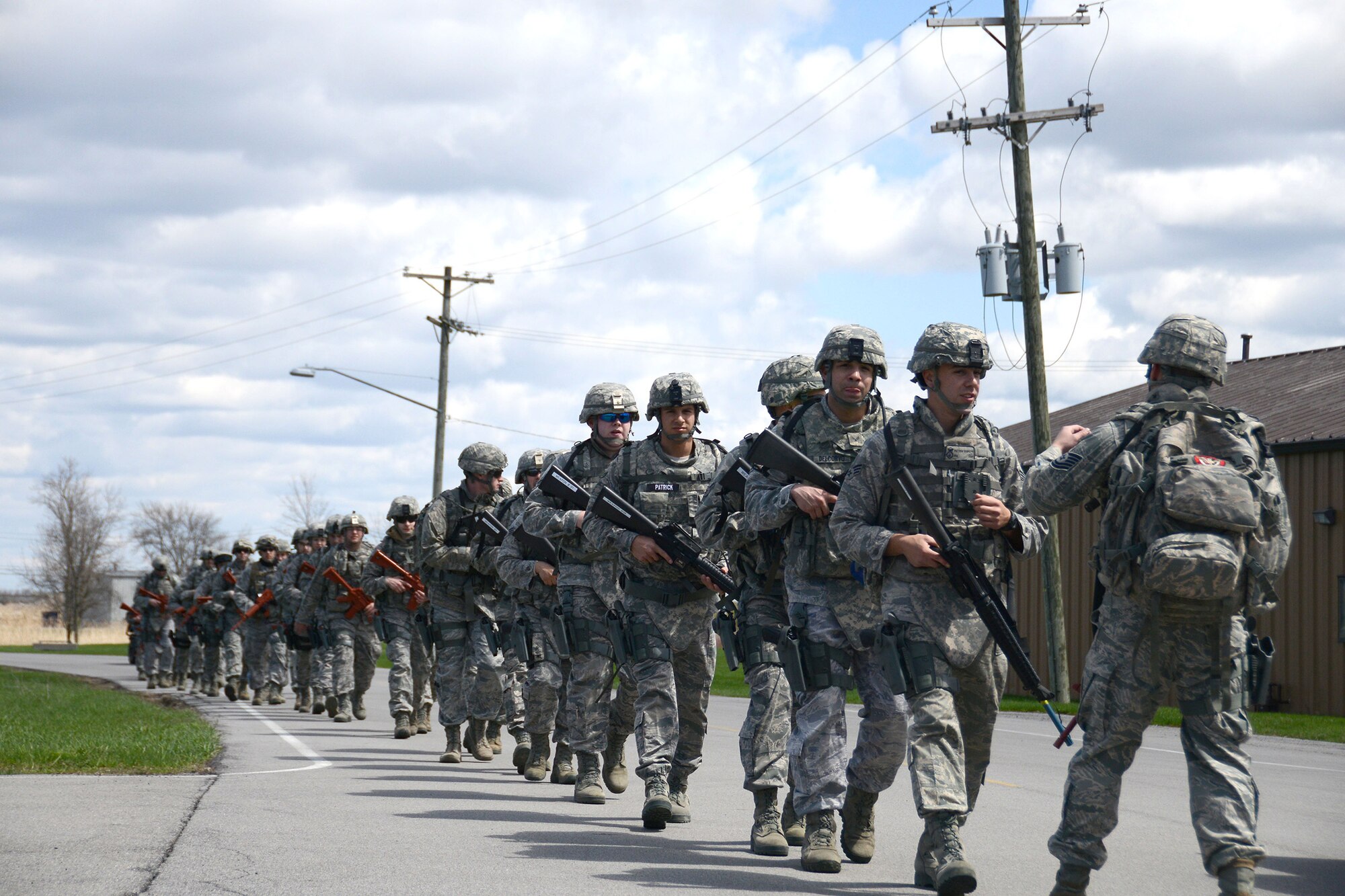 Airmen of the 914th Airlift Wing's Security Forces Squadron participate in a three-mile ruck march during the May Unit Training Assembly, May 3, 2014 at the Niagara Falls Air Reserve Station, N.Y.  The Airmen, each carrying more than 50 pounds of gear, complete morale marches like this quarterly.  (U.S. Air Force photo by Tech. Sgt. Andrew Caya)