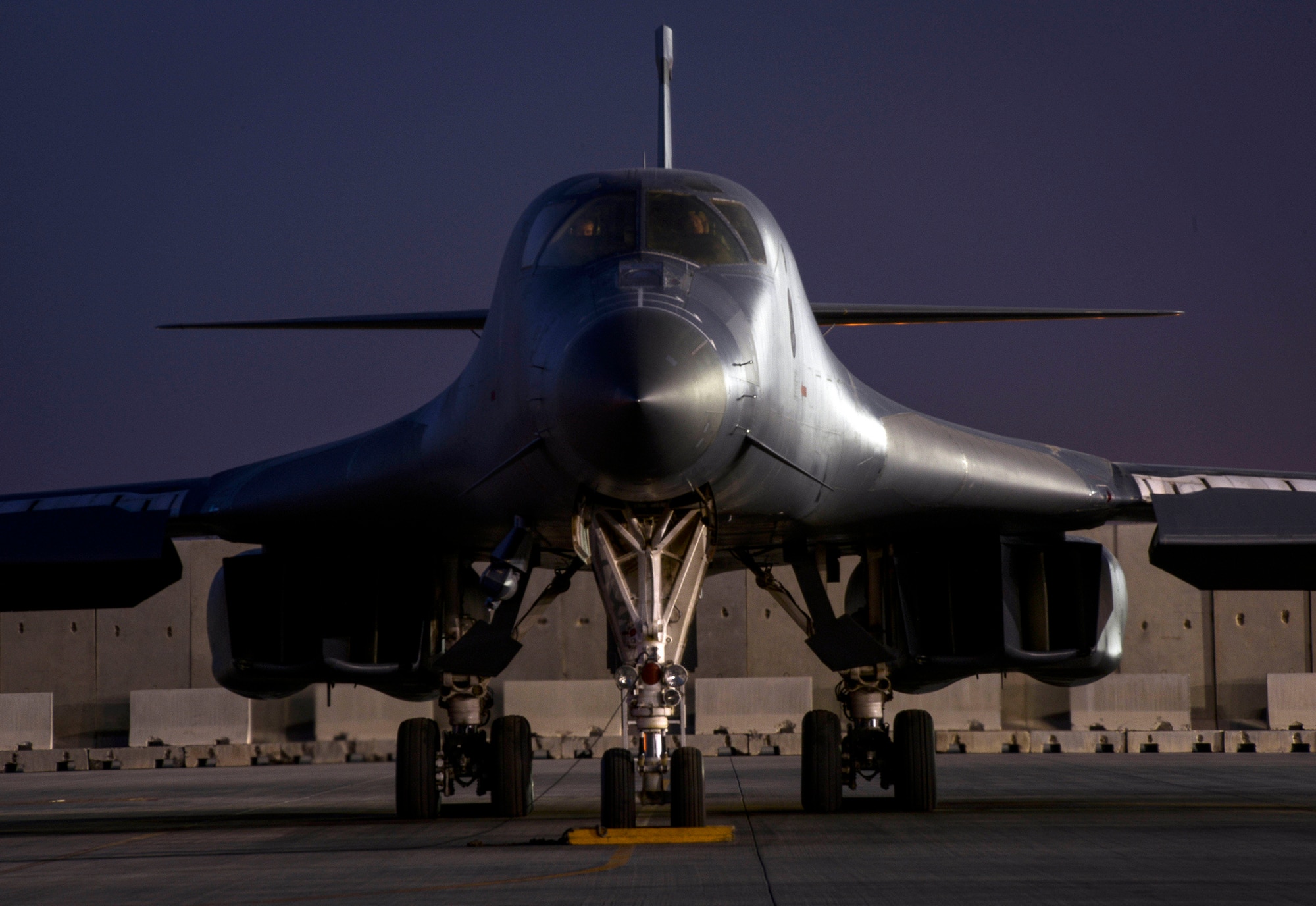 A B-1B Lancer deployed from Ellsworth Air Force Base, South Dakota sits on the flight line, May 4 at Al Udeid Air Base, Qatar. The multi-mission B-1 is the backbone of America's long-range bomber force.  The B-1B's blended wing and body configuration, variable-geometry wings and turbofan afterburning engines, combine to provide long range, maneuverability and high speed while enhancing survivability. (U.S. Air Force photo/Senior Airman Jared Trimarchi)