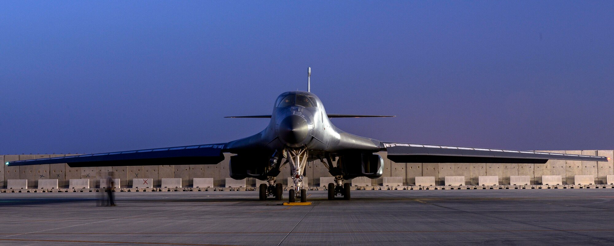A B-1B Lancer deployed from Ellsworth Air Force Base, South Dakota sits on the flight line, May 4 at Al Udeid Air Base, Qatar. The multi-mission B-1 is the backbone of America's long-range bomber force.  The first production B-1 flew in October 1984. (U.S. Air Force photo/Senior Airman Jared Trimarchi)