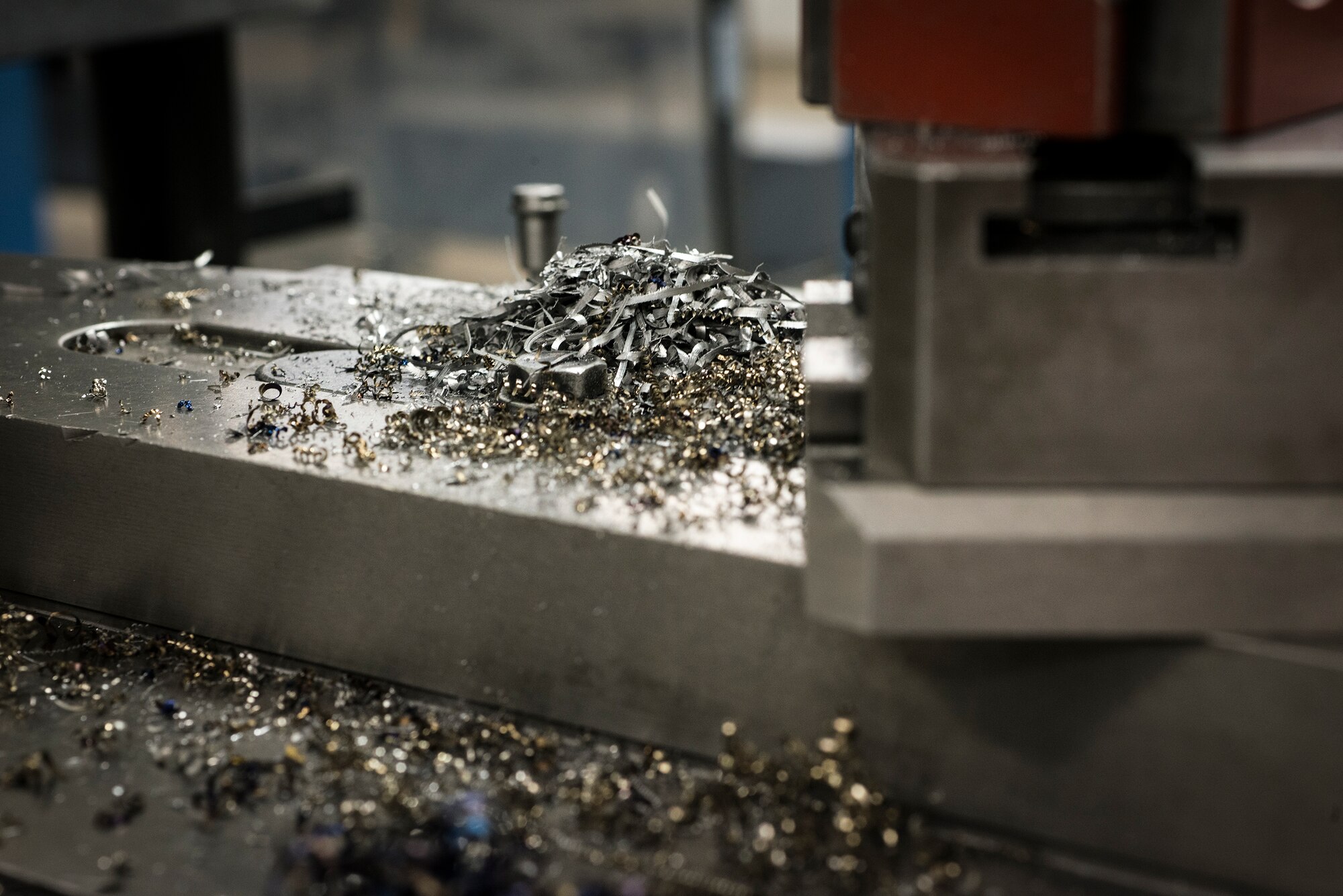 Metals shavings sit in at pile on a lathe at Moody Air Force Base, Ga., April 30, 2014. It takes several hours and multiple Airmen to fabricate each part. (U.S. Air Force photo by Airman 1st Class Ryan Callaghan/Released)