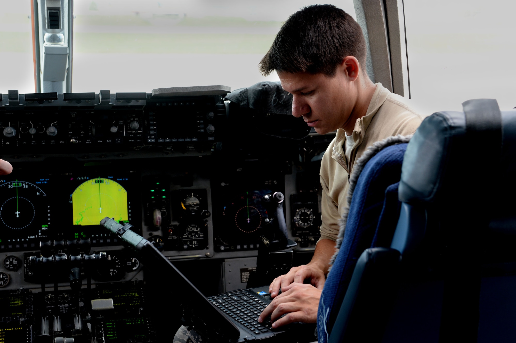 U.S. Air Force Senior Airman Nicholas Matta, 726th Air Mobility Squadron communications and navigation specialist from Hartsdale, Tenn., troubleshoots avionics systems in a U.S. Air Force C-17 Globemaster III Cargo Aircraft system at Spangdahlem Air Base, Germany, May 7, 2014. Upon recovering an aircraft, Airmen from the 726th coordinate with flight crew to prepare for its next departure. (U.S. Air Force photo by Senior Airman Alexis Siekert/Released)