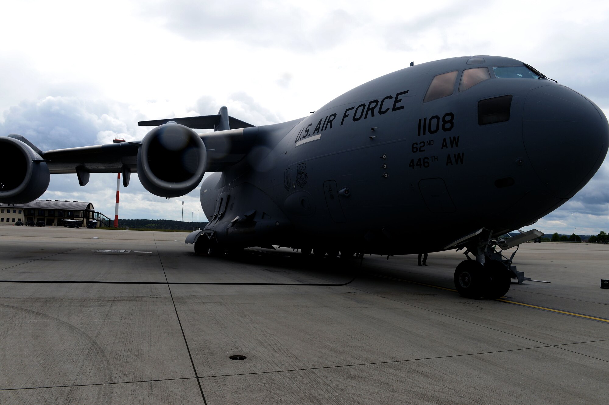 A U.S. Air Force C-17 Globemaster III Cargo Aircraft lands at Spangdahlem Air Base, Germany, May 7, 2014 en route to a downrange location. The C-17 is capable of rapid strategic delivery of troops and all types of cargo to main operating bases or directly to forward bases in the deployment area. (U.S. Air Force photo by Senior Airman Alexis Siekert/Released)