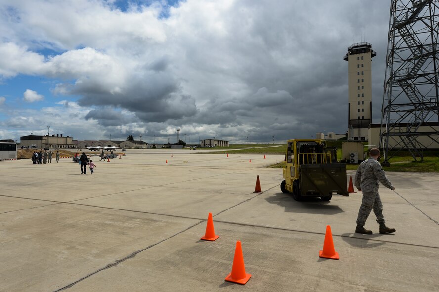 Military families participate in a jammer and forklift course on the flightline during the 52nd Maintenance Group spouse’s tour May 7, 2014, at Spangdahlem Air Base, Germany. The tour showed appreciation for the spouses of MXG Airmen as a part of the Military Spouse Appreciation Day. (U.S. Air Force photo by Senior Airman Rusty Frank/Released)