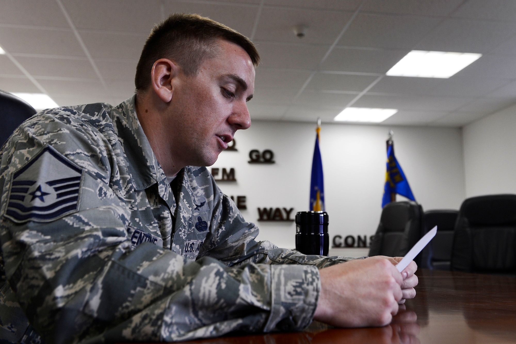U.S. Air Force Master Sgt. Donnie Valentine, 52nd Fighter Wing Inspector General director of complaints resolution from Sandusky, Ohio, reads a scenario during a Sexual Assault Prevention and Response small-group discussion May 7, 2014, at Spangdahlem Air Base, Germany. The scenarios were based off of actual sexual-assault convictions in the Air Force, and the information about the convictions drove attendee discussion during the training. (U.S. Air Force photo by Staff Sgt. Daryl Knee/Released)