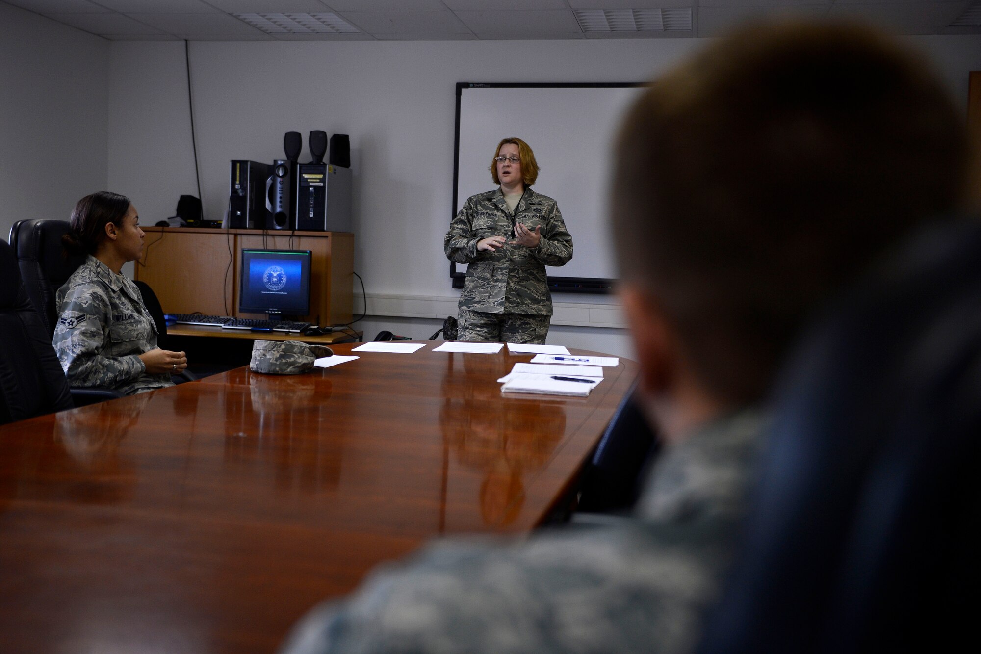 U.S. Air Force Master Sgt. Katherine Devine-Ebert, a 52nd Fighter Wing Sexual Assault Prevention and Response facilitator from Colorado Springs, Colo., conducts a small-group discussion May 7, 2014, at Spangdahlem Air Base, Germany. The discussion focused on identifying patterns most sexual predators display and how Airmen should protect themselves and their fellow wingmen from danger. (U.S. Air Force photo by Staff Sgt. Daryl Knee/Released)