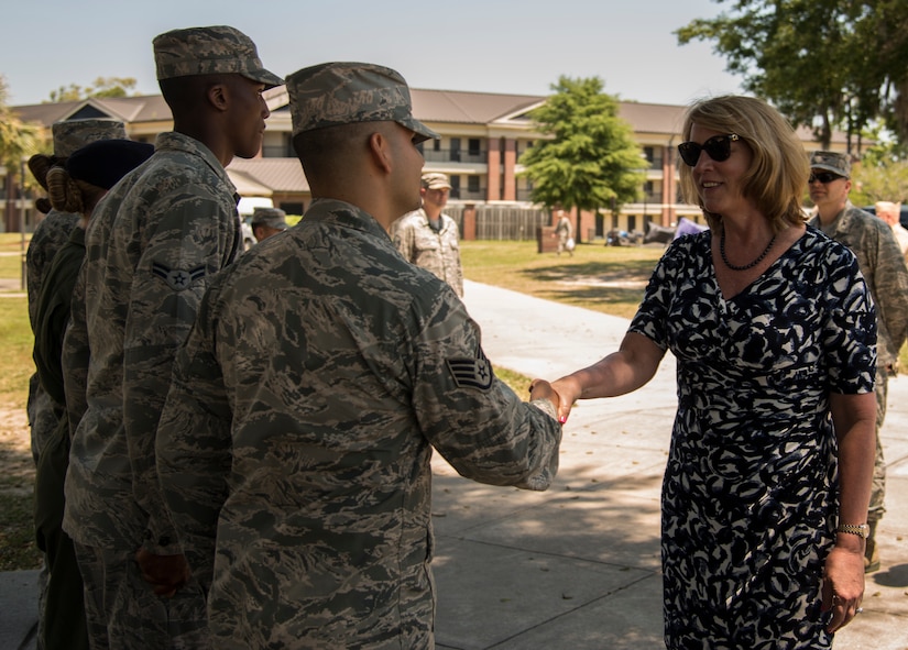 Secretary of the Air Force Deborah Lee James is greeted by Staff Sgt. Jimmy Farias May 6, 2014, at the dorms on Joint Base Charleston, S.C. Farias is the 628th Logistics Readiness Squadron noncommissioned officer in charge of fuels distribution. James is the 23rd Secretary of the Air Force and was appointed to the position Dec, 20, 2013. She is responsible for the affairs of the Department of the Air Force, including organizing, training, equipping and providing for the welfare of its more than 690,000 active-duty, Guard, Reserve and civilian Airmen and their families. (U.S. Air Force photo/ Airman 1st Class Clayton Cupit)