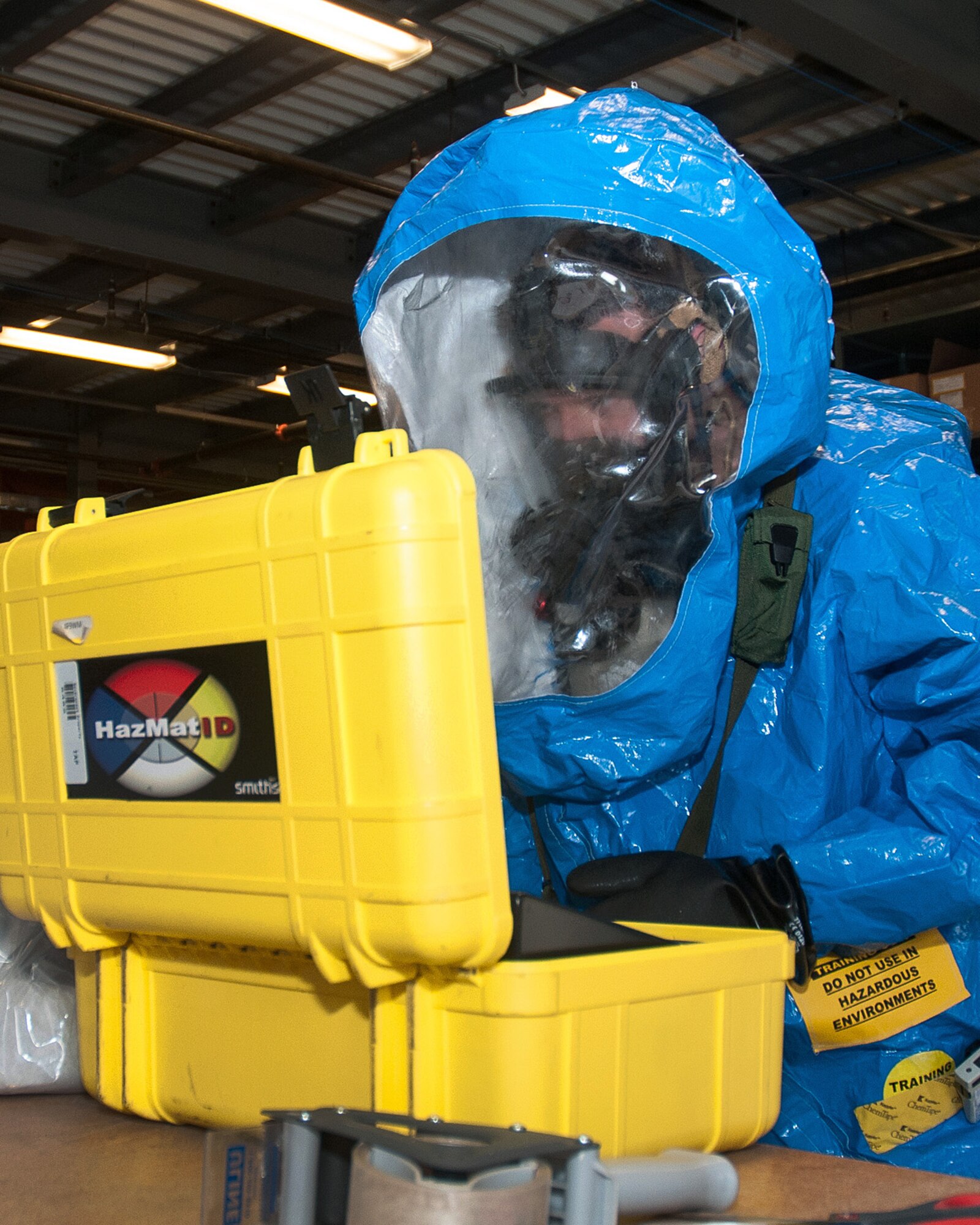 HANSCOM AIR FORCE BASE, Mass. -- Staff Sgt. James Caruso, 66th Medical Squadron bioenvironmental engineer, reads test samples of a simulated substance that was found inside Building 1102D during a base readiness exercise May 6. The exercise simulated a vehicle explosion with the possibility of a chemical agent present. (U.S. Air Force photo by Mark Herlihy)