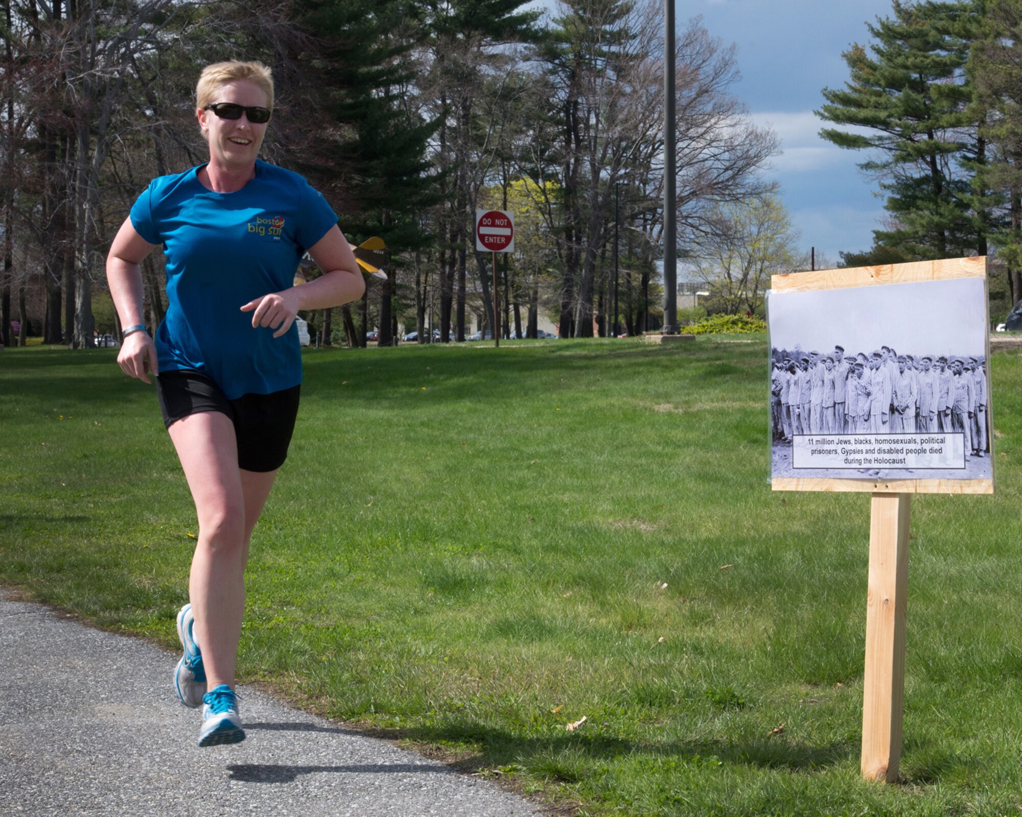 HANSCOM AIR FORCE BASE, Mass. – Capt. Carmen Sowers, 319th Recruiting Squadron, participates in a 5k history run as part of a Holocaust Days of Remembrance observance at Castle Park, May 2. The community was invited to run or walk the course and read fact boards posted along the path to learn more about the Holocaust. (U.S. Air Force photo by Walter Santos) 