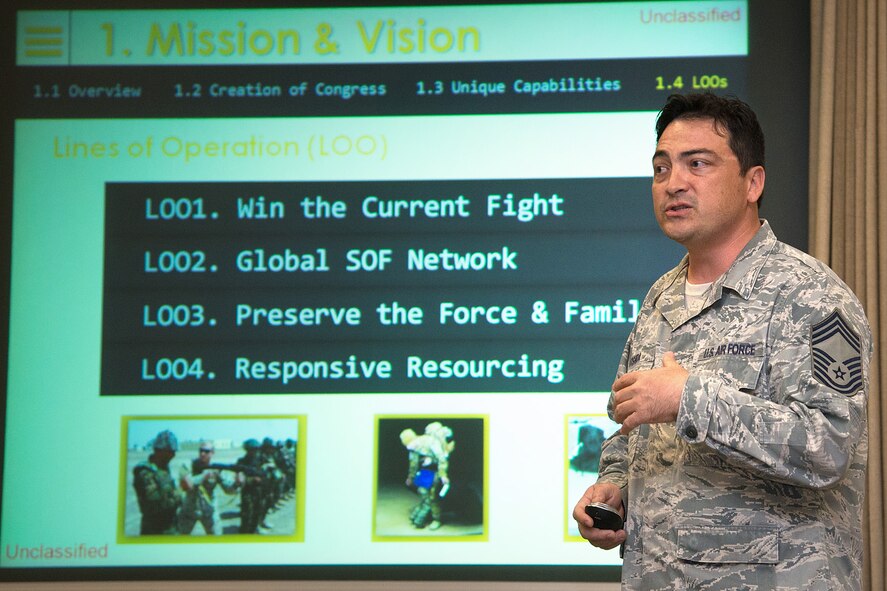 HANSCOM AIR FORCE BASE, Mass. – Chief Master Sgt. Alan Yoshida, a decorated combat controller, speaks to the base community at the Hanscom Conference Center about his experiences in Special Operations Command, May 2. Yoshida also discussed the direction Dismounted Joint Tactical Air Controller equipment is moving and how it utilizes Command, Control and Communications Systems from Hanscom. (U.S. Air Force photo by Walter Santos) 