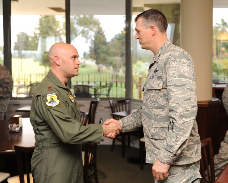 Maj. Ryan Williams, 39th Operations Squadron director of operations, is awarded the "Pick of the 'Lik" for the week of May 7, 2014, Incirlik Air Base, Turkey. The 39th Air Base Wing leadership recognizes Airmen for demonstrating outstanding leadership and job performance abilities. (U.S. Air Force photo by Senior Airman Chase Hedrick/Released)