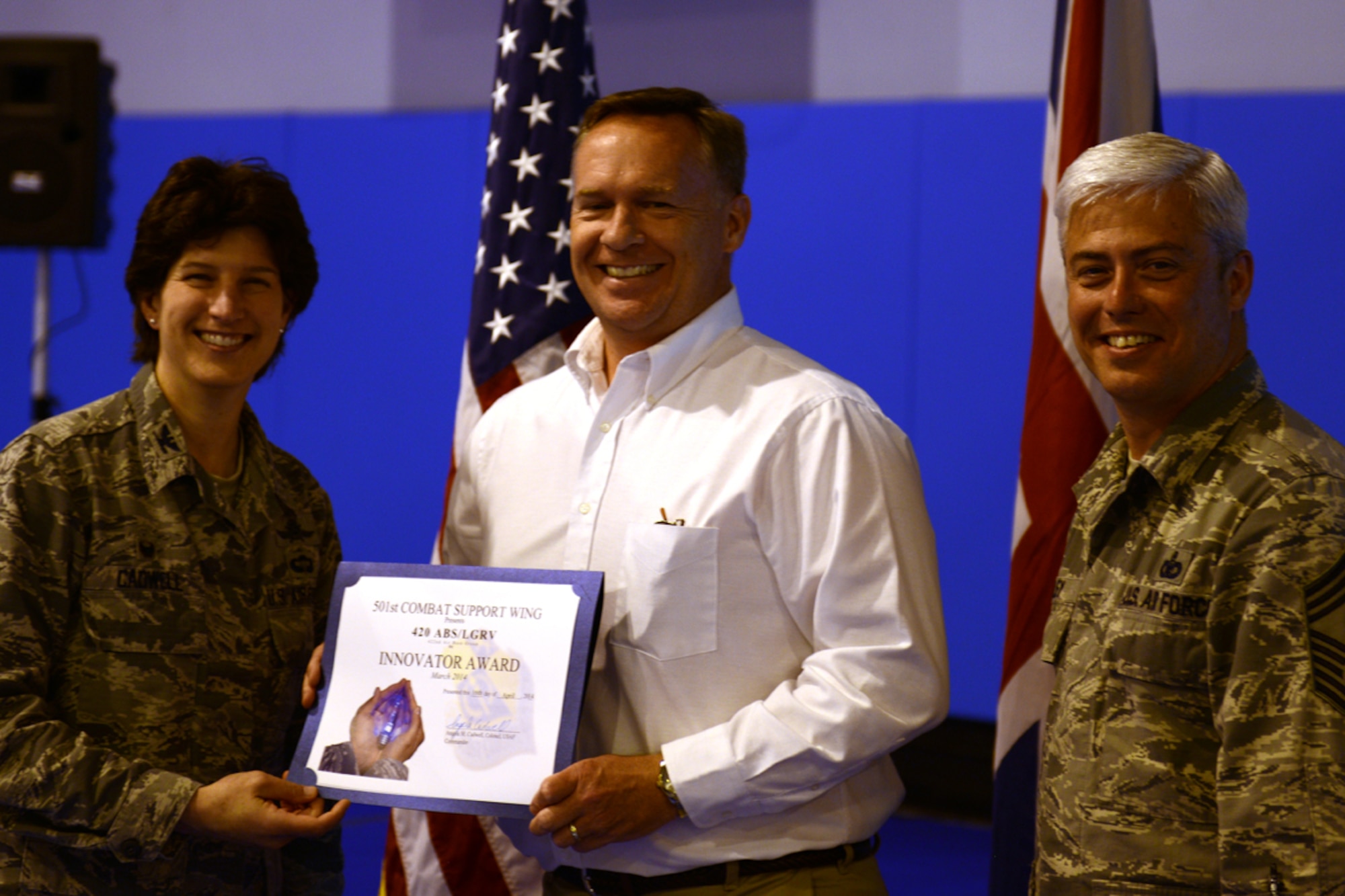 Tim Hershberger, 420th Air Base Squadron site director, accepts the Innovator of the Month award on behalf of his squadron from Col. Angela Cadwell, 501st Combat Support Wing commander, April 17. The award recognized Nigel Mott and Andrew Pole, fire truck mechanics at the 420th ABS for their efforts in utilizing an existing no-foam test trailer to house an ultra-high pressure firefighting tool , saving the squadron from having to purchase additional equipment.

Their efforts to source, configure and troubleshoot the placement of the UHP firefighting tool saved the 420th Fire Emergency Services $5,000 in new trailer and water storage tank expenses. Mott’s and Pole’s innovation also eliminated the need to retrofit a fire emergency services vehicle that had existing equipment storage space limitations.

The UHP firefighting tool enables the 420th ABS to support the global strike mission at RAF Fairford as an additional option to fight aircraft composite fires. (U.S. Air Force photo by Tech. Sgt. Chrissy Best)