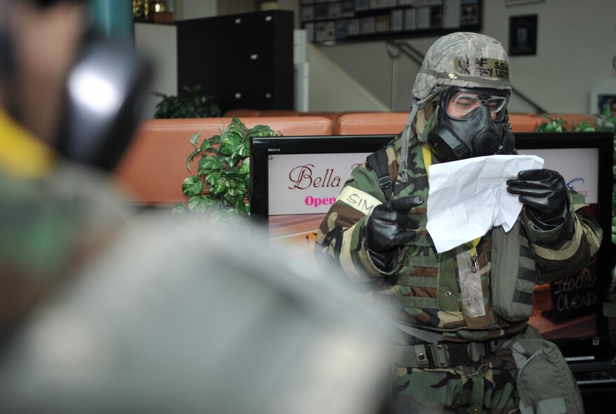 Staff Sgt. Avery Usita, 51st Fighter Wing Equal Opportunity Office, takes accountability of the members of his group after evacuating  during Operational Readiness Exercise Beverly Bulldog 14-02 at Osan Air Base, Republic of Korea, May 8, 2014. Maintaining accountability of personnel in emergency situations is critical to keeping them safe and ensuring leaders have a clear idea of what each unit’s capabilities are at any given time. (U.S. Air Force photo/Airman 1st Class Ashley J. Thum) 
