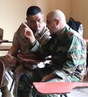 Sgt. Maj. Mario Marquez speaks with Brig. Gen. Khalil El Jomayyel about classes conducted during an enlisted leadership seminar hosted by the 4th Intervention Regiment in Beirut, Lebanon on March 11, 2014. During the seminar, Marines from Command Element Marine Forces Central Command Forward and soldiers from the 4th Intervention Regiment discussed leadership principles and the role of Non-Commissioned Officers in military units. (U.S. Marine Corps photo by; Sgt James A. Hall, CE MARFOR CENTCOM (FWD) Combat Camera/Released)