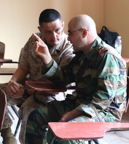 Sgt. Maj. Mario Marquez speaks with Brig. Gen. Khalil El Jomayyel about classes conducted during an enlisted leadership seminar hosted by the 4th Intervention Regiment in Beirut, Lebanon on March 11, 2014. During the seminar, Marines from Command Element Marine Forces Central Command Forward and soldiers from the 4th Intervention Regiment discussed leadership principles and the role of Non-Commissioned Officers in military units. (U.S. Marine Corps photo by; Sgt James A. Hall, CE MARFOR CENTCOM (FWD) Combat Camera/Released)