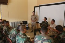 Sgt. Ahmed Khalil translates for Sgt. James Hall during an enlisted leadership seminar hosted by the 4th Intervention Regiment in Beirut, Lebanon on March 11, 2014. During the seminar, Marines from Command Element Marine Forces Central Command Forward and soldiers from the 4th Intervention Regiment discussed leadership principles and the role of Non-Commissioned Officers in military units. (U.S. Marine Corps photo by; Sgt James A. Hall, CE MARFOR CENTCOM (FWD) Combat Camera/Released)