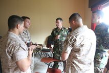 Lt. Col. Charbel Barakat and 1st Lt. Karim Al Mashtoub speak with Marines from Command Element, Marine Forces Central Command Forward during an enlisted leadership seminar hosted by the 4th Intervention Regiment in Beirut, Lebanon on March 12, 2014. During the seminar, Marines from Command Element Marine Forces Central Command Forward and soldiers from the 4th Intervention Regiment discussed leadership principles and the role of Non-Commissioned Officers in military units. (U.S. Marine Corps photo by; Sgt James A. Hall, CE MARFOR CENTCOM (FWD) Combat Camera/Released)