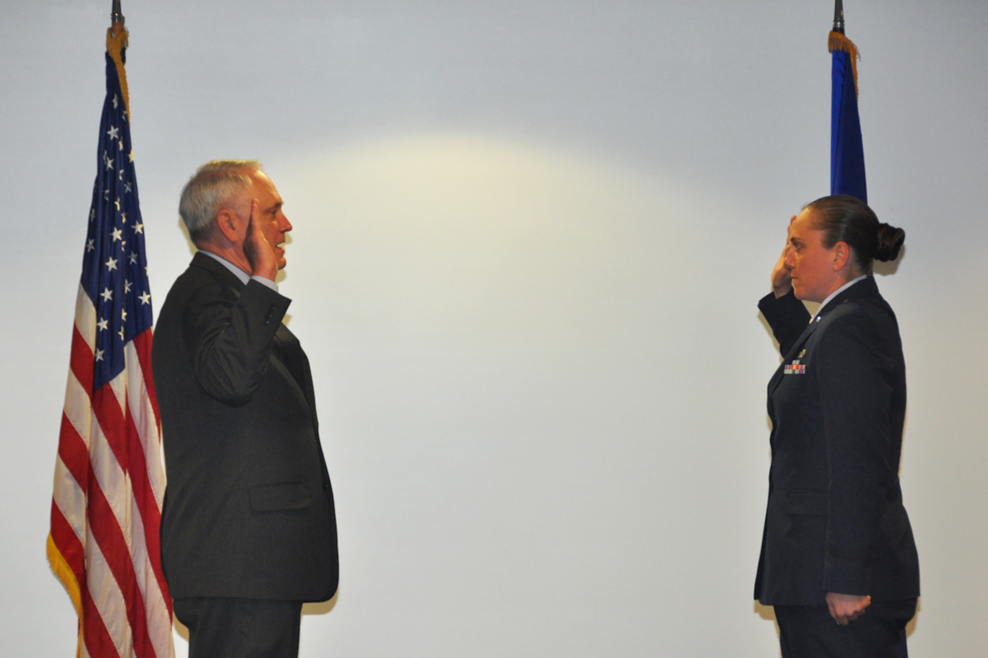 2nd Lt. Elizabeth Van Patten is administered the oath of office by her father, Army Col. (Ret) James Van Patten, during her Officer Training School graduation ceremony, Maxwell Air Force Base, Ala., May 1. (U.S. Air Force photo/Master Sgt. James Branch)