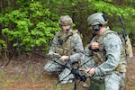 Air Force 2nd Lt. TJ Bertsch, an air liaison officer, left, and Senior Airman Luke Molidor, a joint terminal attack controller, both from the 14th Air Support Operations Squadron, Pope Army Airfield, N.C., direct close air support operations with the Air Support Operations Center using a satellite communications antenna. The ASOC is the primary command and control agency for integrating joint air power with Army operations. Fighter duty technicians coordinate air support for the JTACs and provide airspace de-confliction for tasked aircraft. Once JTACs receive a handoff of aircraft from the ASOC, it's their job to direct the fighters to the correct targets within close proximity to ground forces using radios and communications equipment. (U.S. Air Force photo/Marvin Krause)