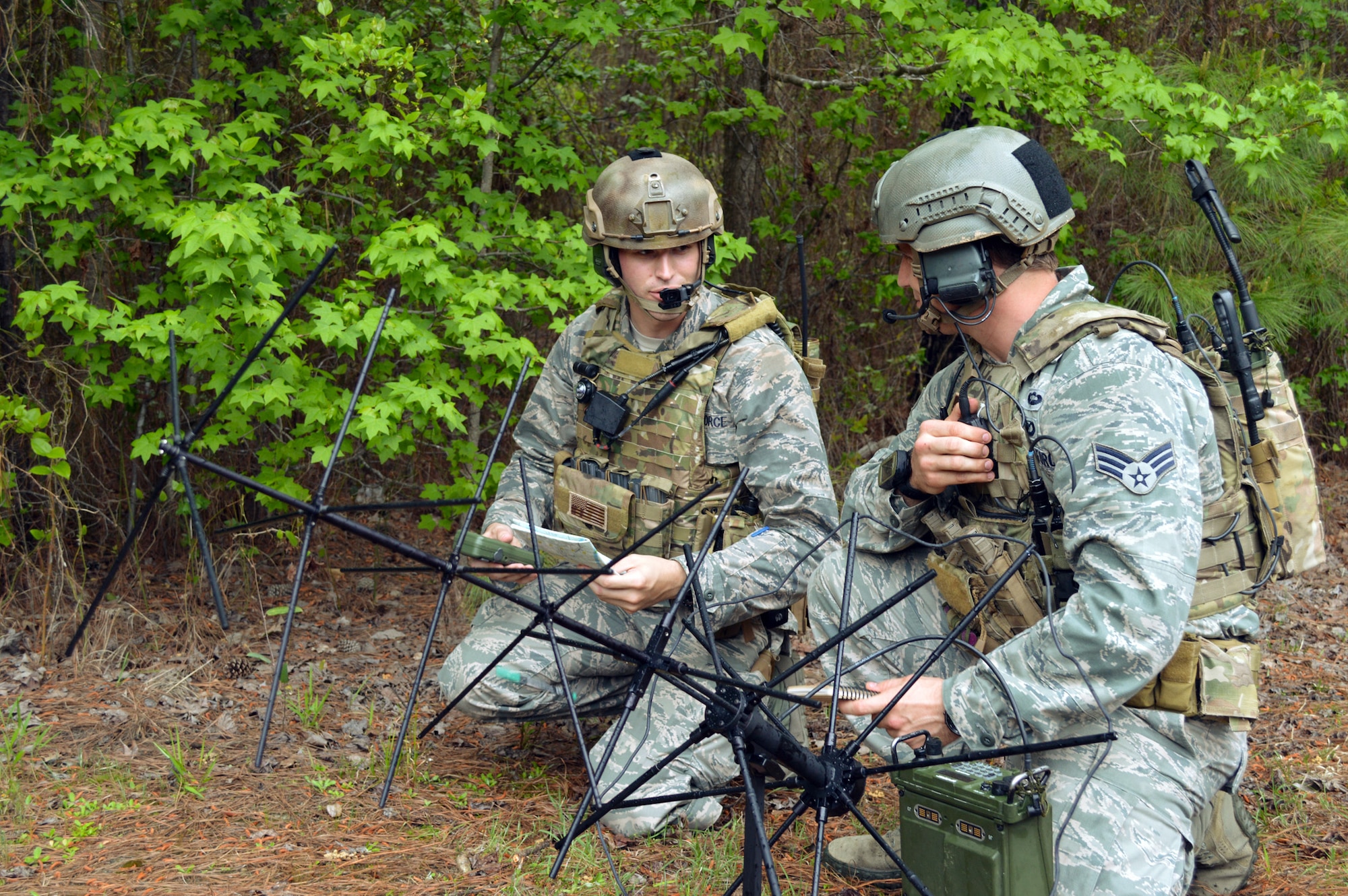 Air Force 2nd Lt. TJ Bertsch, an air liaison officer, left, and Senior Airman Luke Molidor, a joint terminal attack controller, both from the 14th Air Support Operations Squadron, Pope Army Airfield, N.C., direct close air support operations with the Air Support Operations Center using a satellite communications antenna. The ASOC is the primary command and control agency for integrating joint air power with Army operations. Fighter duty technicians coordinate air support for the JTACs and provide airspace de-confliction for tasked aircraft. Once JTACs receive a handoff of aircraft from the ASOC, it's their job to direct the fighters to the correct targets within close proximity to ground forces using radios and communications equipment. (U.S. Air Force photo/Marvin Krause)