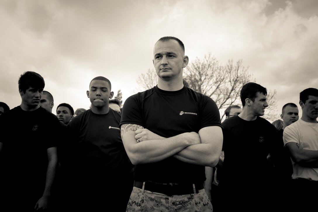 U.S. Marine Corps Staff Sgt. Richard Perreault, the staff non-commissioned officer of Recruiting Sub-Station Salisbury, and a native of Bangor, Maine, stands with members of Marine Corps Recruiting Station Baltimore’s delayed entry program during RS Baltimore’s annual statewide pool function at Aberdeen Proving Grounds, Md., April 26, 2014. The purpose of the statewide pool function is to build camaraderie among the members of the delayed entry program while physically and mentally preparing them for recruit training. (U.S. Marine Corps photo illustration by Sgt. Bryan Nygaard/Released)