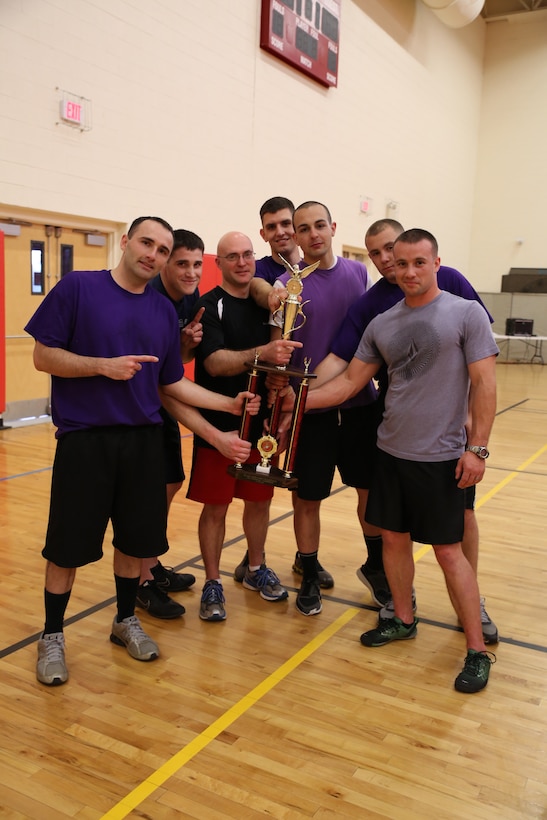 Sgt. Joe David Garcia, Sgt. Joshua Blanchard, Capt. Jarrod Robinson, Cpl. Ryan Hylinski, Cpl. Anthony Osmond, Cpl. Robert Smith, Staff Sgt. Cole Nason, members of the Purple Cobras team form Marine Corps Air Facility Quantico, pose for a photo at Barber Physical Activity Center on April 30, 2014. They won first place in the second Headquarters and Service Battalion Quarterly Dodgeball Tournament of 2014.