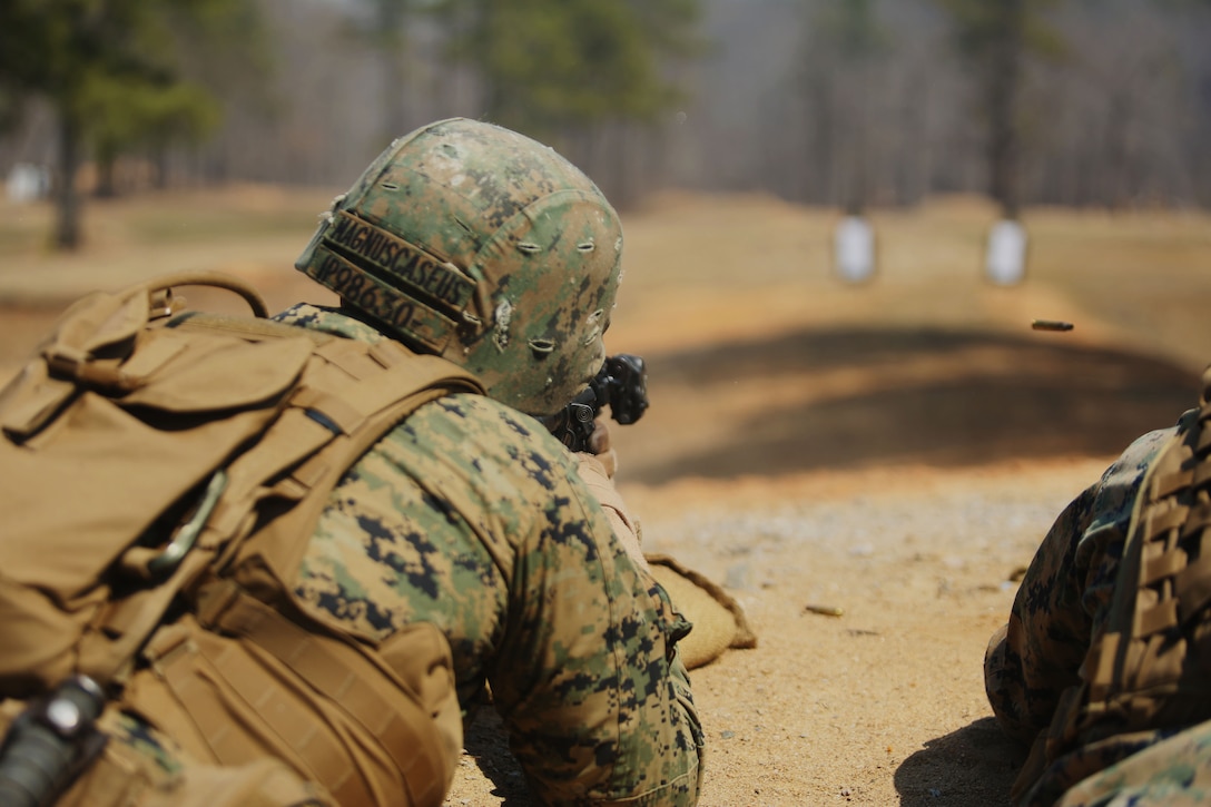 Corporal Ian Phillips, a squad automatic weapon gunner with Scout Platoon, 2nd Tank Battalion, 2nd Marine Division, and native of Savannah, Ga., fires his M4 Carbine at targets during unknown distance training as part of the Combat Marksmanship Training at Ft. Pickett, Va., April 2, 2014. “It is good to know you hit the target and if it were an enemy trying to kill you or your brothers that you can take him out first,” said Cpl. Patrick W. Westcott, a Tiverton, R.I. native and team leader with Scout Platoon.